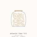 Pellon polyester fiberfill shown loose beside its bag